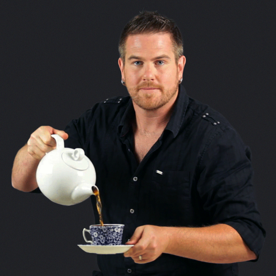 Dom pouring an infinitesimal amount of tea.