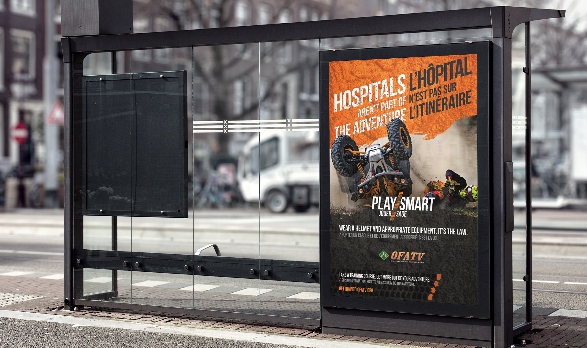 Bus shelter ad shows ATV rollover with text: ‘Hospitals aren’t part of the adventure / L’hôpital n’est pas sur l’itinéraire.’