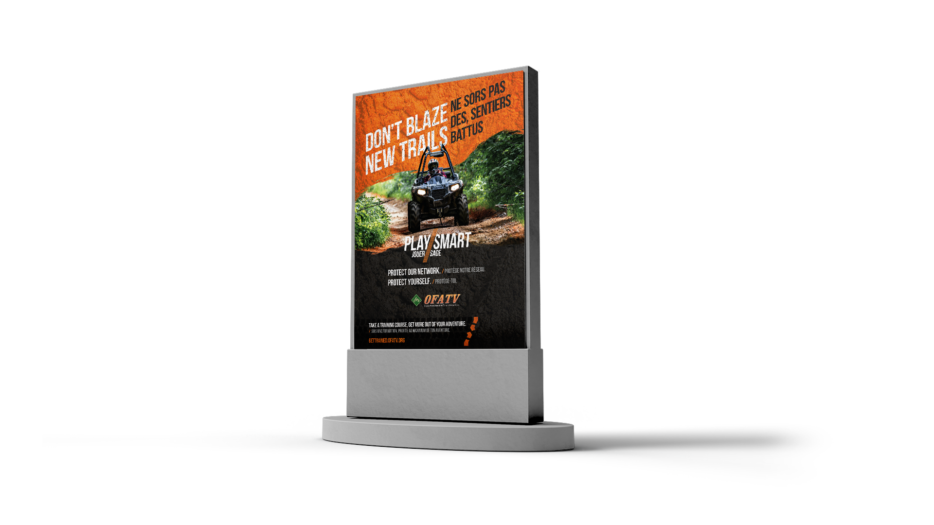 Outdoor kiosk on white background showing ATV safety ad with message: ‘Don’t blaze new trails / Ne sois pas des sentiers battus.’