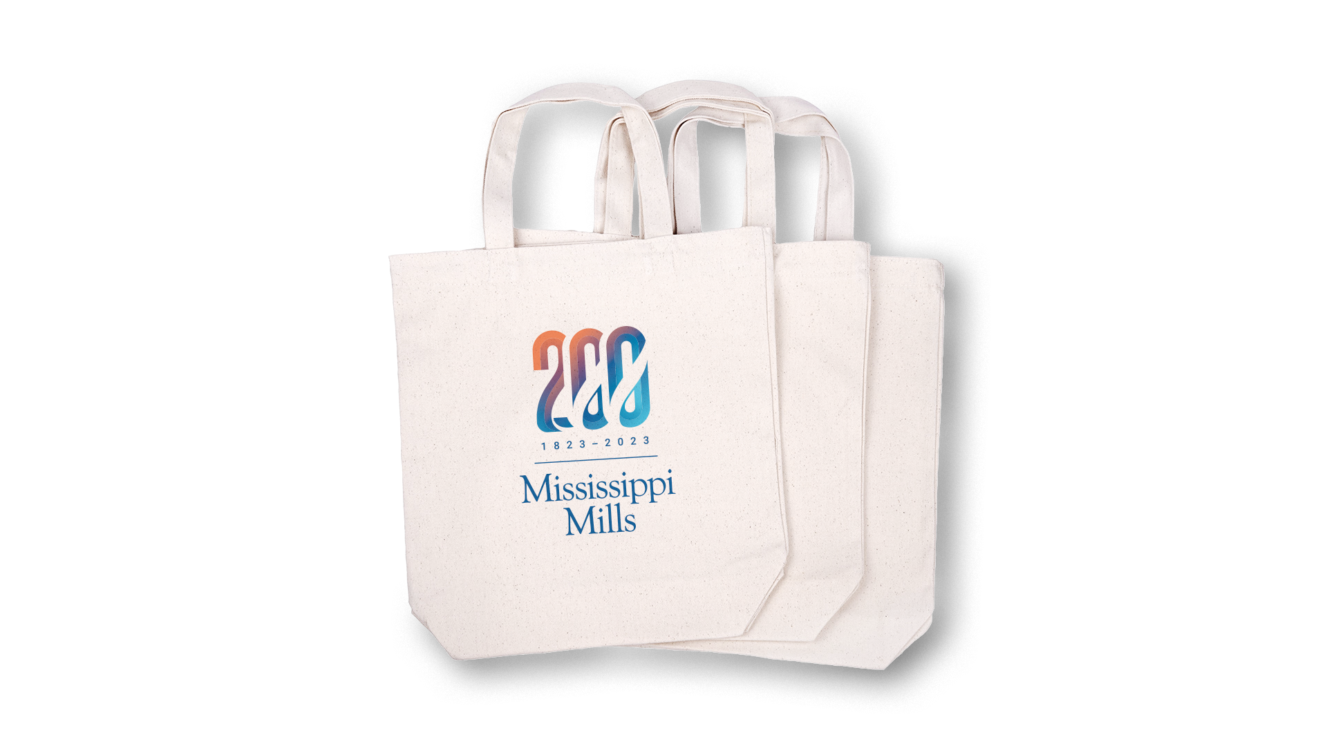 Three canvas tote bags with the Mississippi Mills bicentennial logo centred on the front.