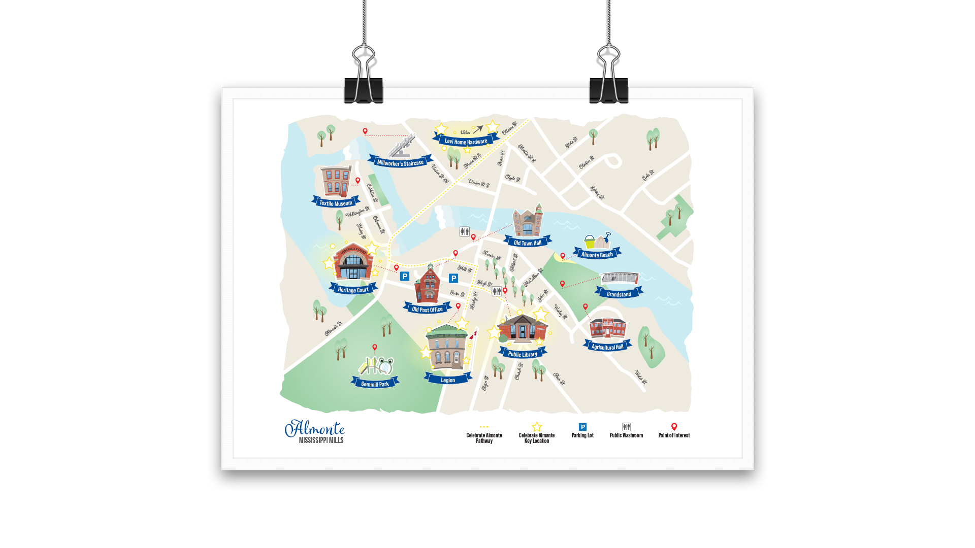 Hanging paper clips holding Mississippi Mills map highlighting key Almonte locations.
