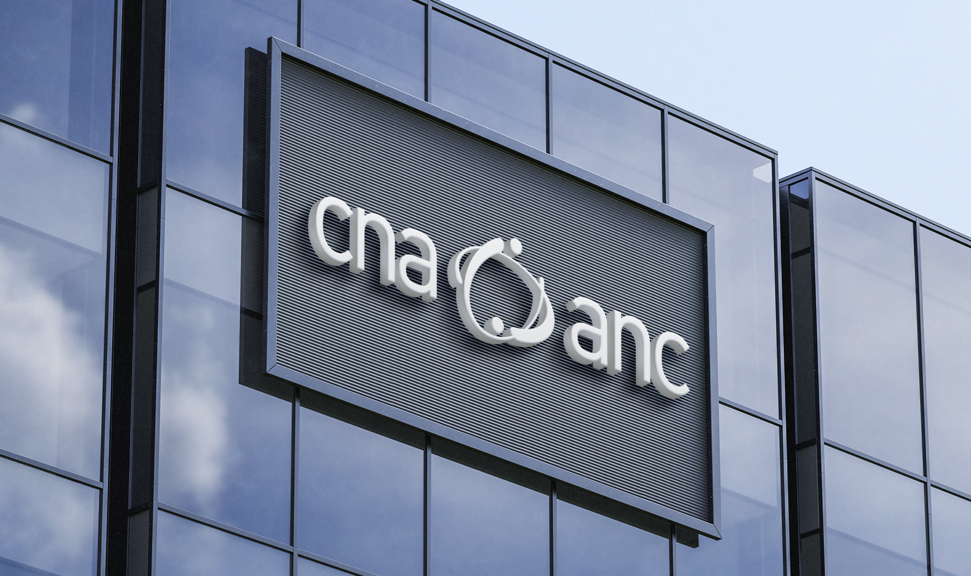 Bilingual CNA logo on black sign mounted to a modern building exterior.