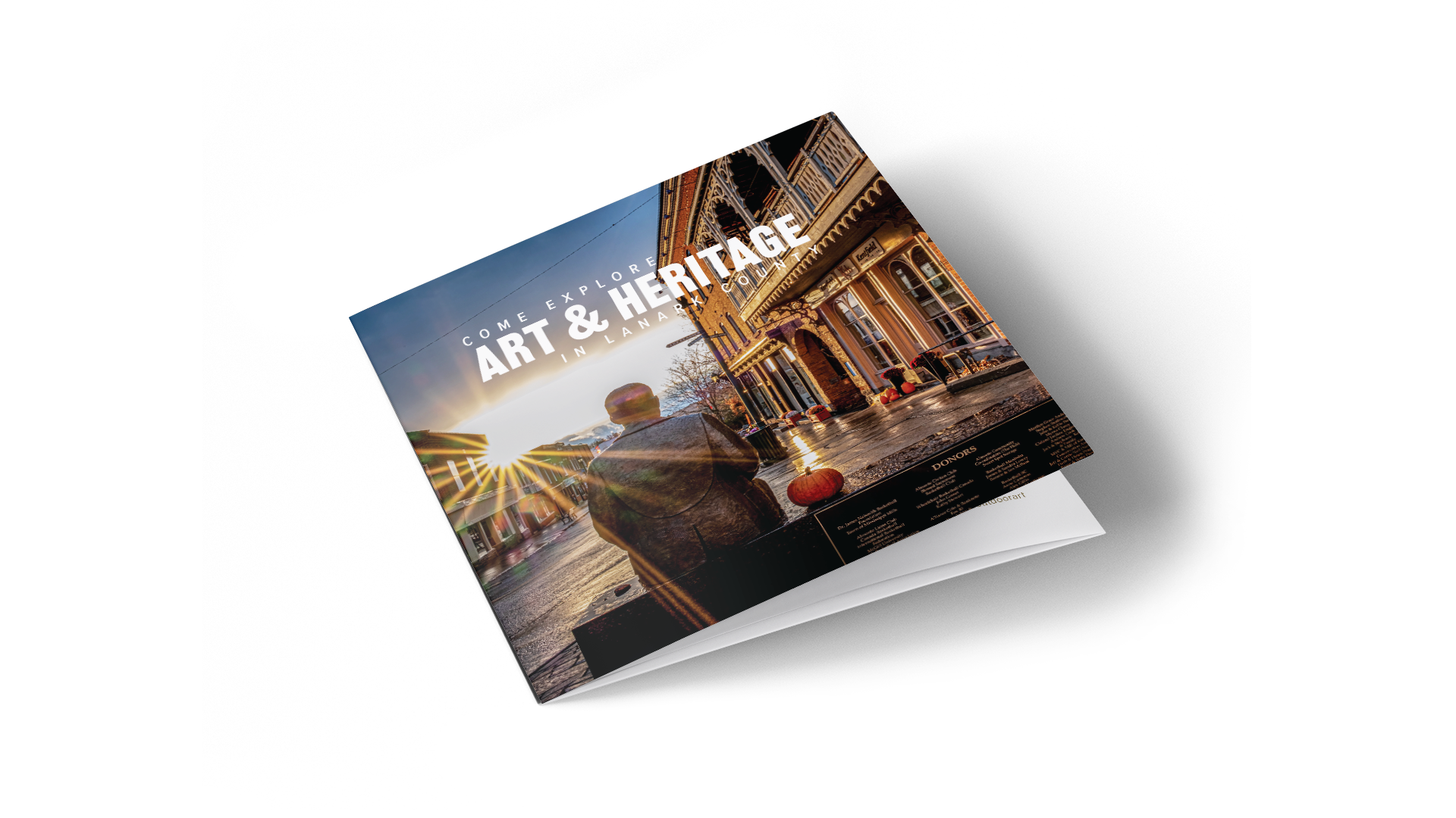 Lanark County tourist guide cover titled “Art and Heritage” with James Naismith statue in Almonte as background.