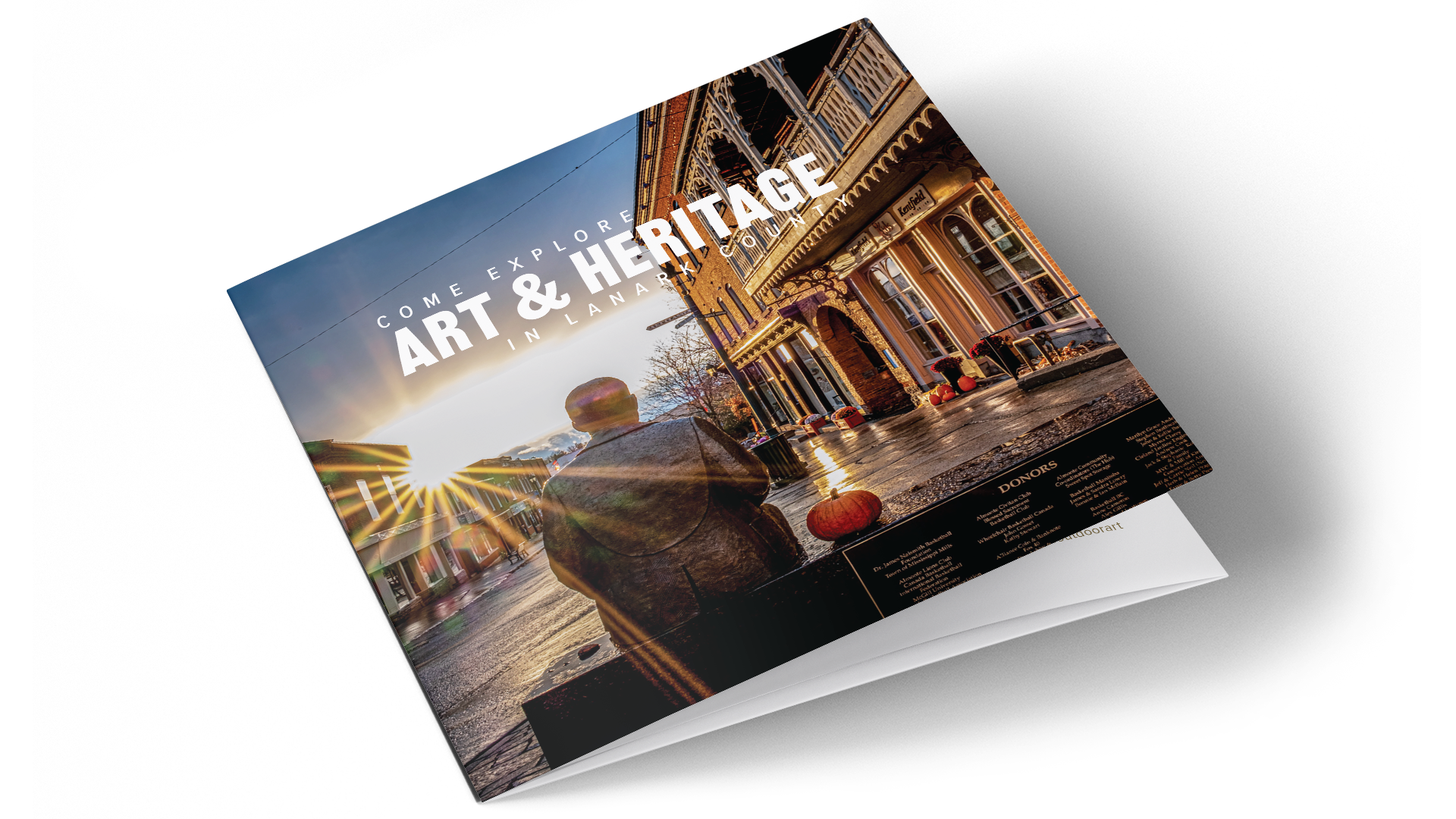 Lanark County tourist guide cover titled “Art and Heritage” with James Naismith statue in Almonte as background.
