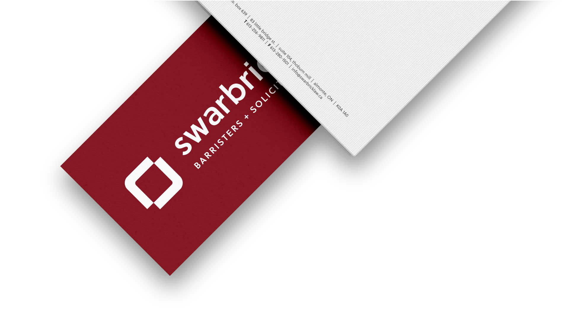 Burgundy business card back with Swarbrick Law logo centred in white.