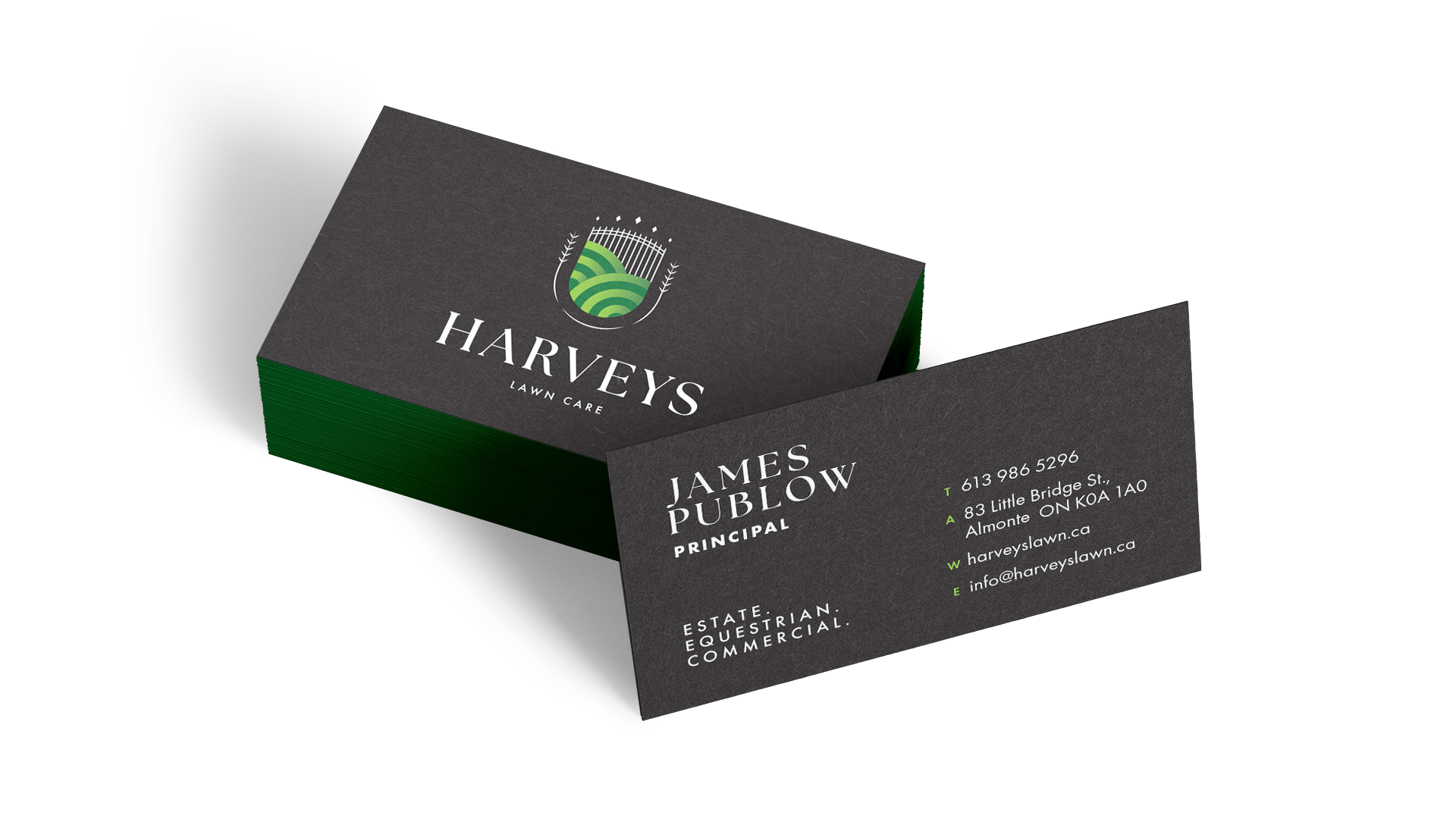 Front and back of black business card, with Harvey’s Lawn Care logo in white and vibrant greens.